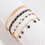 Load image into Gallery viewer, Ensemble de Bracelets Plaqué Or et Noirs – Élégance et Raffinement
