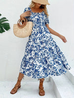Load image into Gallery viewer, Robe Midi à Motif Floral Bleu - L&#39;Essence de l&#39;Élégance Estivale
